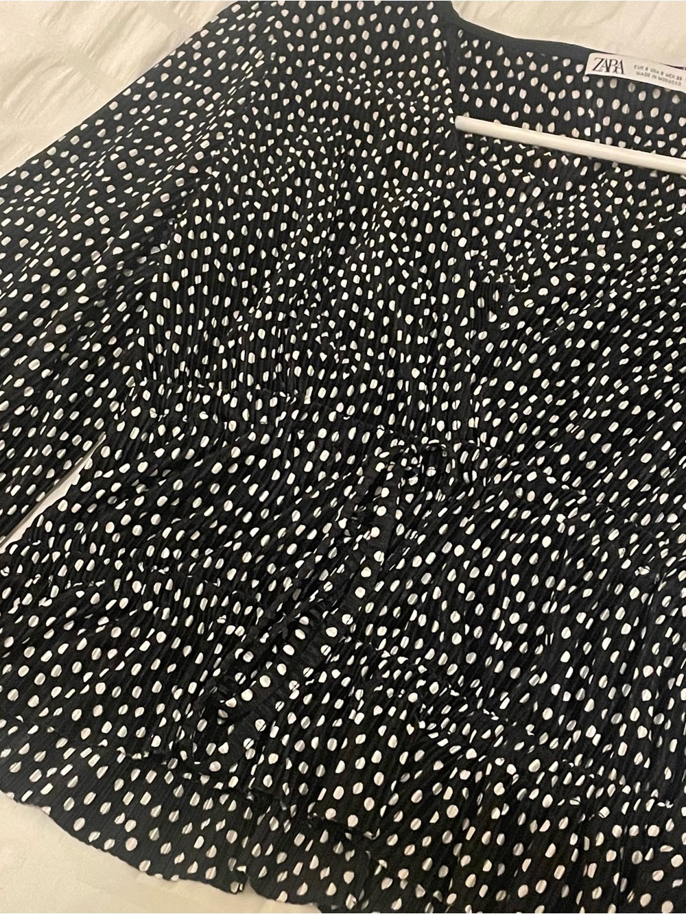 Black and white polkadot blouse